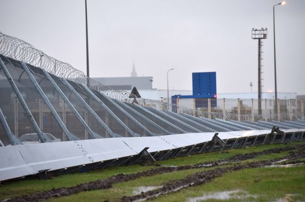 Calais-fence-blown-down.jpg