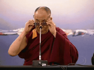 Dalai-Lama-Take-Off-Glasses-and-Laugh.gif